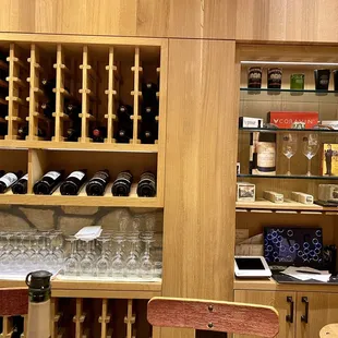 a wine rack with wine glasses