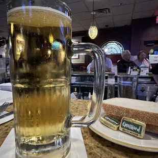 a glass of beer and a sandwich