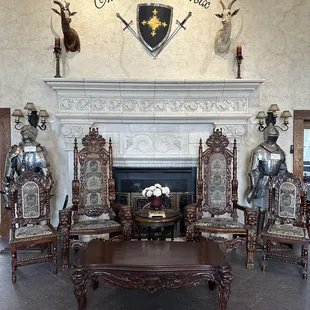 a fireplace and chairs