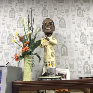 a figurine of a man holding a cigar