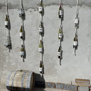 wine bottles hanging on a wall