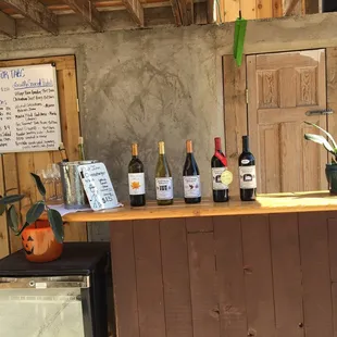 a bar with wine bottles on it