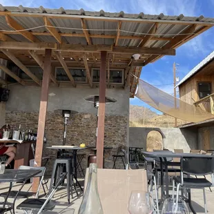 a patio with tables and chairs