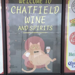 a cat with a glass of wine