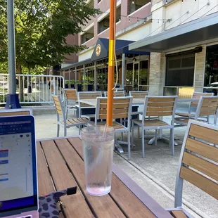 a glass of water and a laptop on a table