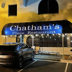 a car parked in front of the restaurant