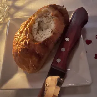 a loaf of bread and a knife