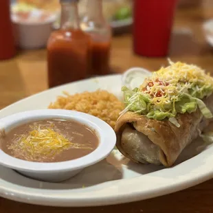 Always great food and exceptional service! (Pictured: Red Chili Chimichanga | Ribeye, Baked Potato, &amp; Garden Salad | Cutest lil' sign!