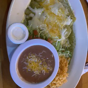 Green Chicken Enchiladas With A Side Of Rice And Beans