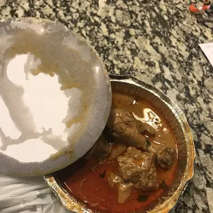 a bowl of stew and a bowl of rice