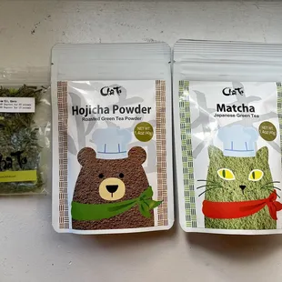 two bags of cat food and a bag of matcha