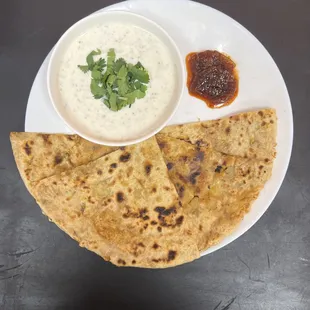 a plate of flatbreads and dip