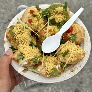 a person holding a plate of food