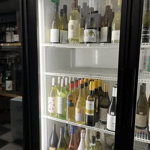 a refrigerator full of wine bottles