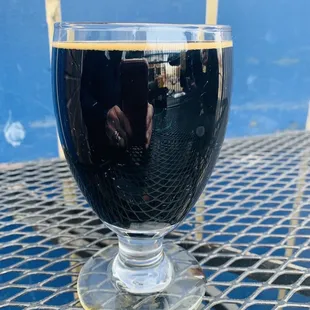 a glass of beer on a table