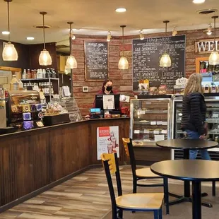 a coffee shop with tables and chairs
