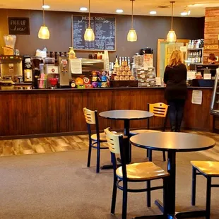 a cafe with tables and chairs