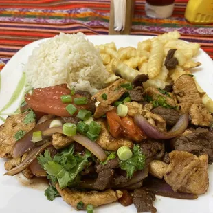 Lomo Saltado with pollo added.