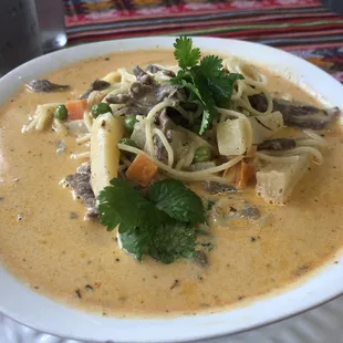 Sopa a La Minuta Beef broth with pieces of beef, potatoes, angel hair noodles, peas, carrot, cilantro, oregano, and cream