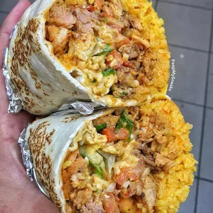 chaufa wrap with steak, chicken, shrimp, eggs and fried rice. Served with french fries and green hot sauce/aj.