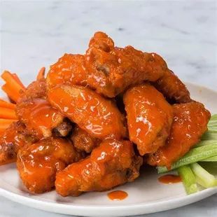 Buffalo wings. 8 piece wings, french fries and a choice of blue cheese or ranch sauce.