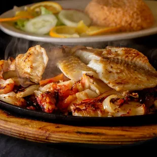 a plate of chicken and vegetables
