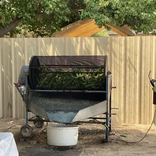 a man standing next to a machine