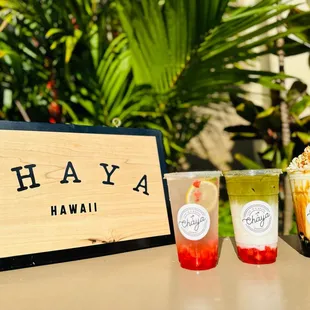 three different drinks on a table