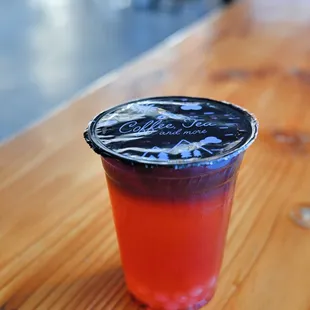 a plastic cup on a wooden table