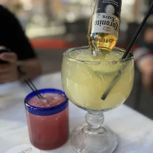 a margarita and a bottle of tequila