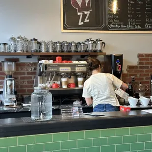 a person working in a coffee shop