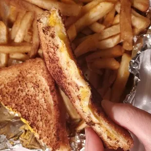 The famous grilled cheese that is supposed to have FOUR slices of grilled cheese and come on sourdough bread.
