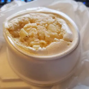 Disgusting melted container of mac and cheese coming out of the bottom