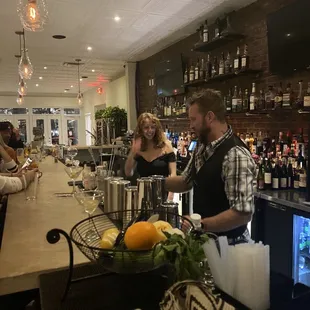 a man and woman at the bar