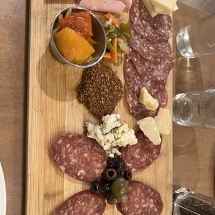 a platter of meat and cheese