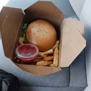 Lamb burger with fries and ketchup