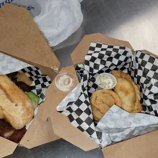 Chicken milanesa sandwhich and chicken and birria empanadas and house made chips
