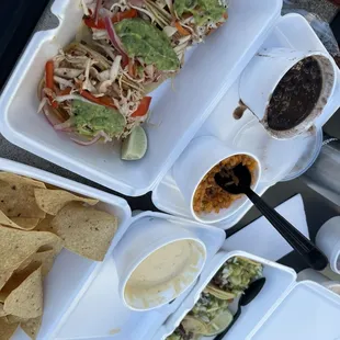 Fish &amp; barbacoa tacos, rice &amp; beans  and queso &amp; chips.