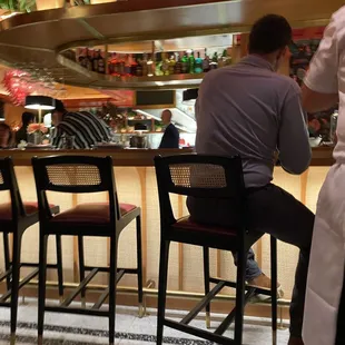 a man sitting at a bar