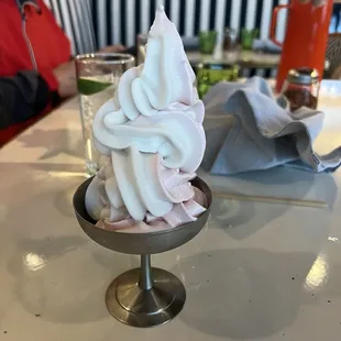 Swirl of strawberry gelato and lime coconut sorbet.