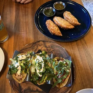 Top: korean bbq/ short rib/ chicken salsa verde empanadas  bottom: trio tacos