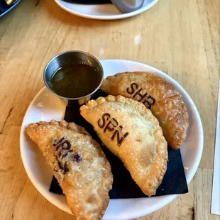Spinach, jerk chicken, and short rib empanada