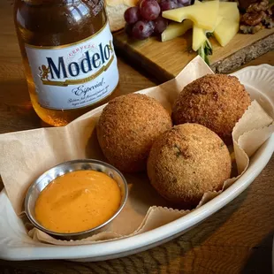 a plate of food and a bottle of beer