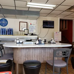 the counter and chairs in the restaurant
