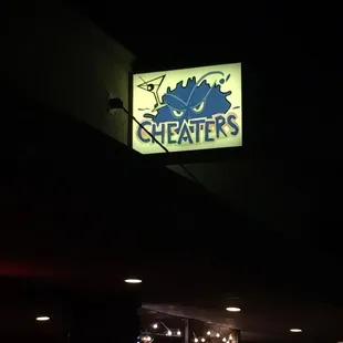 a neon sign in the dark