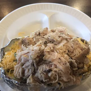 Pulled smoked chicken baked potato. $$$