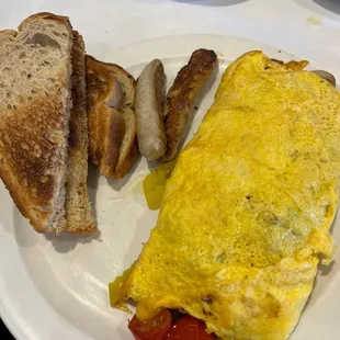 an omelet, toast, and sausage