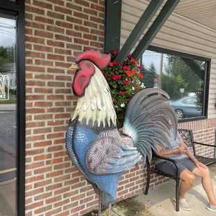 The rooster greets you at door
