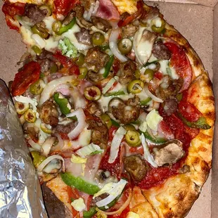 a half eaten pizza in a box