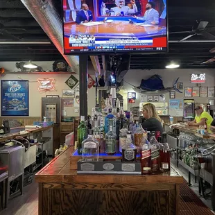 a bar with a television in the background